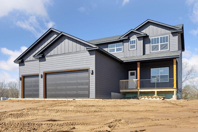 21346 Cottonwood St NW, Oak Grove, MN 55011 - view of front of home featuring a porch, board and batten siding, a garage, and roof with shingles