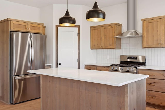 21346 Cottonwood St NW, Oak Grove, MN 55011 - kitchen featuring appliances with stainless steel finishes, wall chimney exhaust hood, tasteful backsplash, a kitchen island, and light wood-type flooring