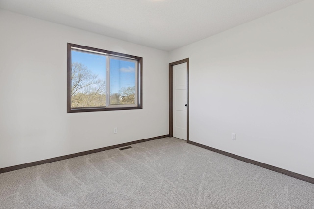 21346 Cottonwood St NW, Oak Grove, MN 55011 - unfurnished room featuring carpet and baseboards