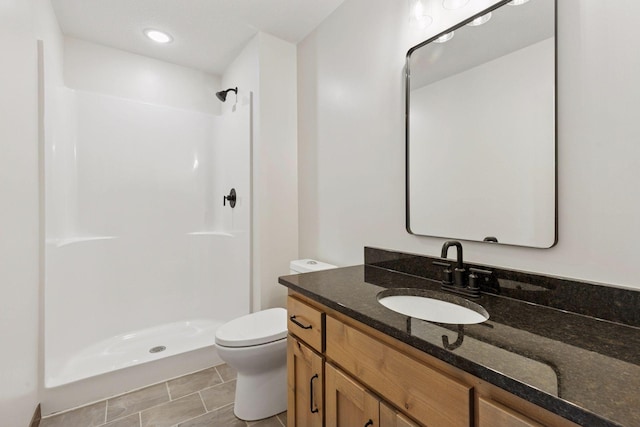 21346 Cottonwood St NW, Oak Grove, MN 55011 - bathroom featuring a shower stall, toilet, and vanity