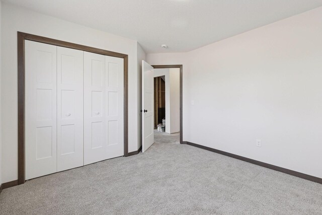 21346 Cottonwood St NW, Oak Grove, MN 55011 - unfurnished bedroom with carpet flooring, baseboards, and a closet