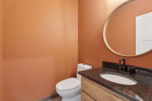 21346 Cottonwood St NW, Oak Grove, MN 55011 - half bath featuring toilet, vanity, and tile patterned floors