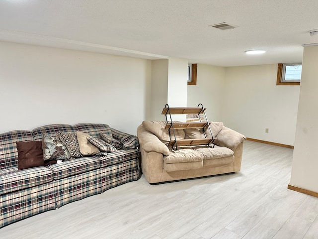 1429 Circle Dr, Albert Lea, MN 56007 - living room with wood finished floors, baseboards, and a textured ceiling