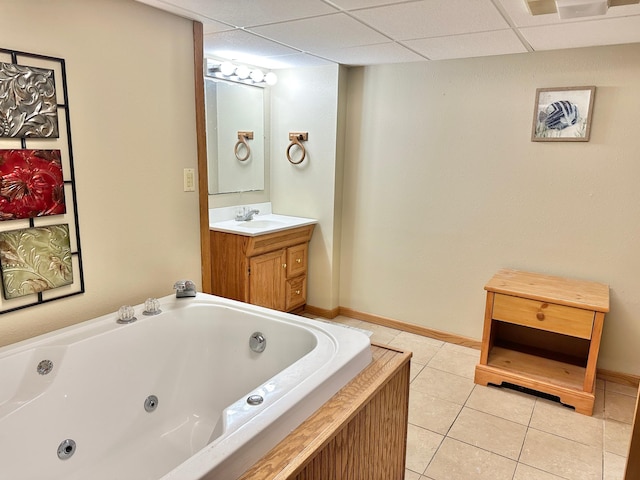 1429 Circle Dr, Albert Lea, MN 56007 - bathroom featuring a tub with jets, vanity, tile patterned floors, and baseboards
