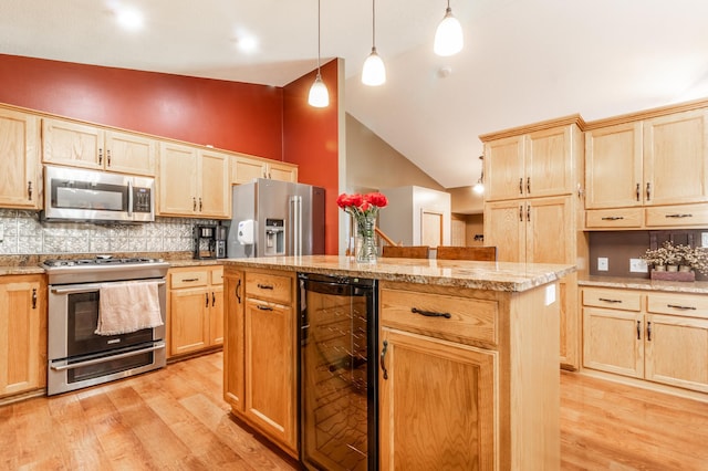 kitchen featuring appliances with stainless steel finishes, wine cooler, light brown cabinets, light wood finished floors, and high vaulted ceiling