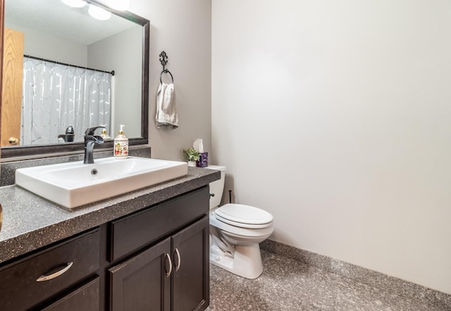 full bath with toilet and vanity