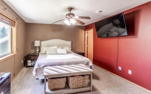 bedroom featuring carpet flooring and a ceiling fan
