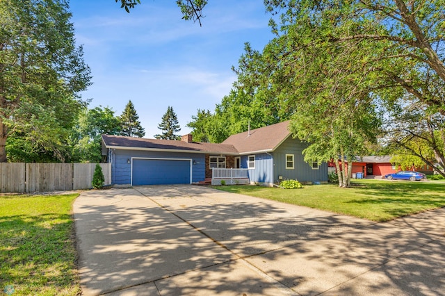 ranch-style house featuring concrete driveway, a chimney, a garage, and covered porch