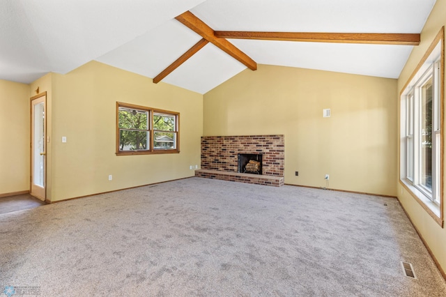 unfurnished living room with carpet, a brick fireplace, and baseboards