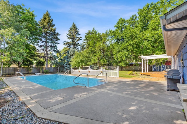 view of swimming pool featuring a fenced backyard, a deck, grilling area, and a patio