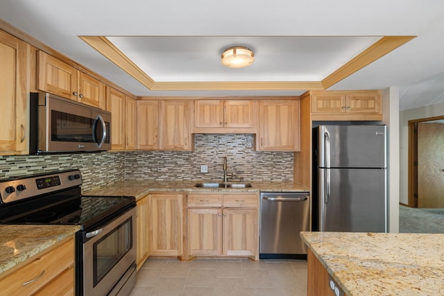2885 Knox Ave S Unit 208, Minneapolis, MN 55408 - kitchen with appliances with stainless steel finishes, a sink, a tray ceiling, and backsplash