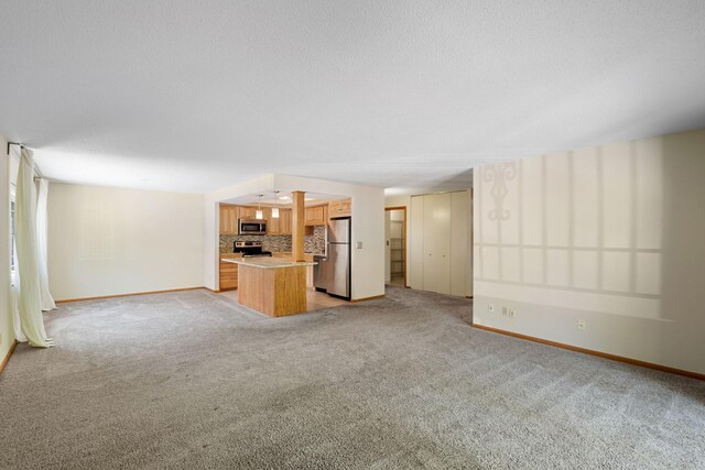 2885 Knox Ave S Unit 208, Minneapolis, MN 55408 - unfurnished living room featuring baseboards and light carpet