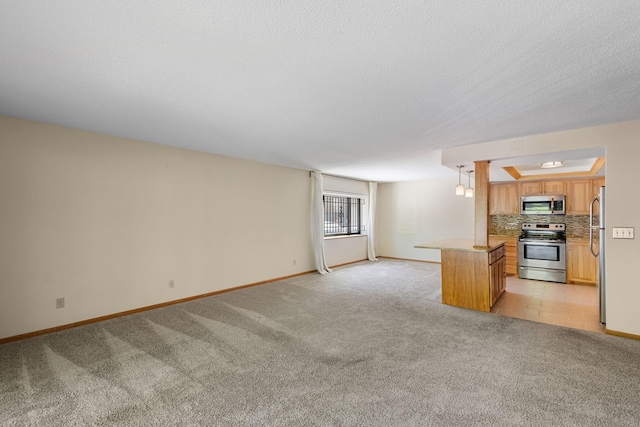 2885 Knox Ave S Unit 208, Minneapolis, MN 55408 - kitchen featuring appliances with stainless steel finishes, open floor plan, and light colored carpet
