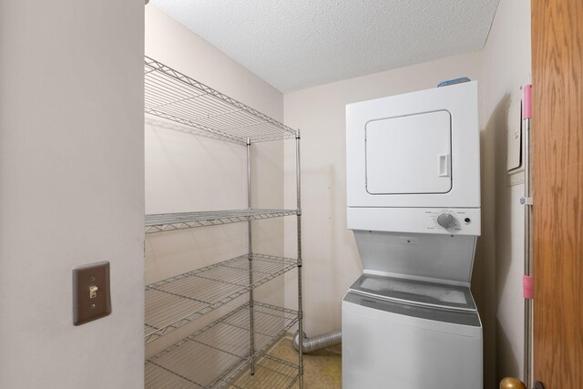2885 Knox Ave S Unit 208, Minneapolis, MN 55408 - washroom with estacked washer and dryer and a textured ceiling