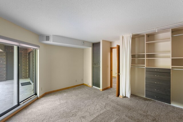 2885 Knox Ave S Unit 208, Minneapolis, MN 55408 - unfurnished bedroom with carpet, a textured ceiling, access to exterior, a closet, and baseboards