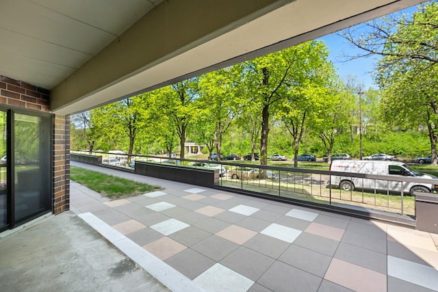 2885 Knox Ave S Unit 208, Minneapolis, MN 55408 - view of patio featuring view of wooded area