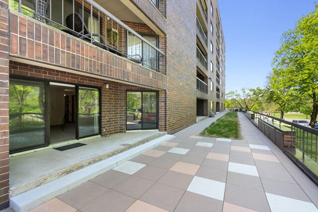 2885 Knox Ave S Unit 208, Minneapolis, MN 55408 - view of patio featuring a balcony