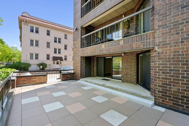 2885 Knox Ave S Unit 208, Minneapolis, MN 55408 - view of patio / terrace featuring a balcony and a grill