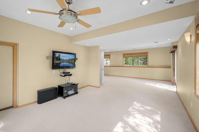 unfurnished living room with light colored carpet, ceiling fan, recessed lighting, and baseboards
