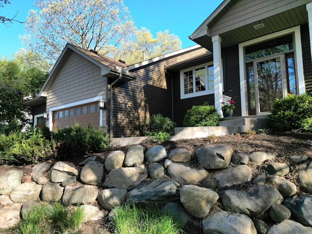 view of property exterior with a garage