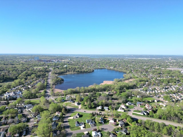 aerial view of property and surrounding area featuring a large body of water