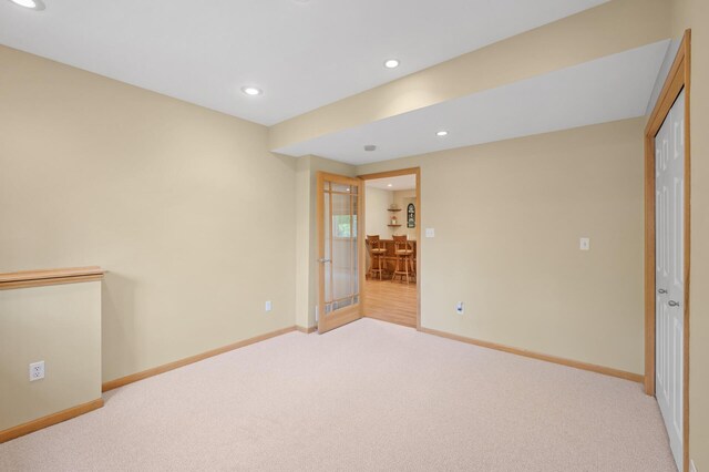 unfurnished bedroom featuring carpet floors, baseboards, and recessed lighting