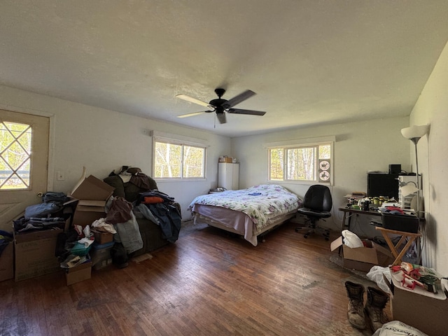 3545 White Birch Ave NE, Bemidji, MN 56601 - bedroom featuring wood finished floors, a ceiling fan, and an office area