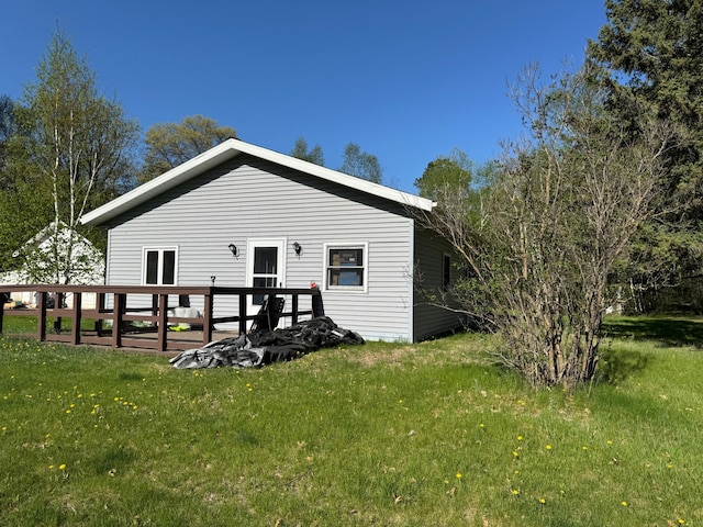 3545 White Birch Ave NE, Bemidji, MN 56601 - back of property with a lawn and a deck