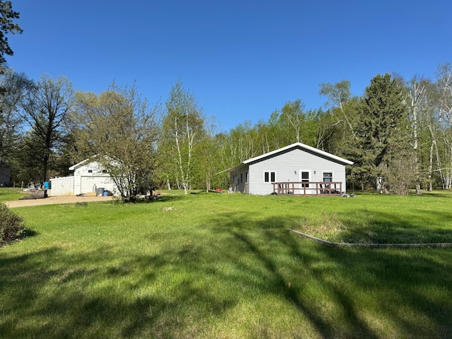 3545 White Birch Ave NE, Bemidji, MN 56601 - view of grassy yard featuring a wooden deck