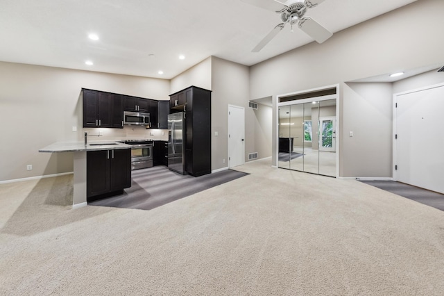 10911 Rhode Island Ave S, Bloomington, MN 55438 - kitchen featuring appliances with stainless steel finishes, a sink, light carpet, baseboards, and recessed lighting
