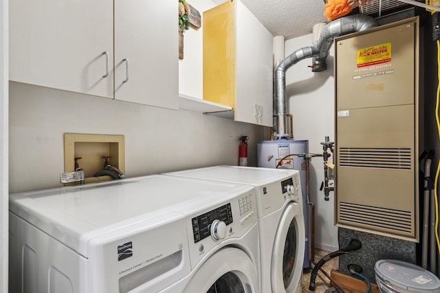 10911 Rhode Island Ave S, Bloomington, MN 55438 - laundry room featuring cabinet space, washer and dryer, and heating unit