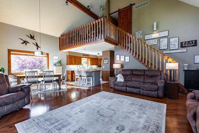 6385 13th Ave NW, Rochester, MN 55901 - living room featuring high vaulted ceiling, healthy amount of natural light, dark wood-style flooring, and stairway
