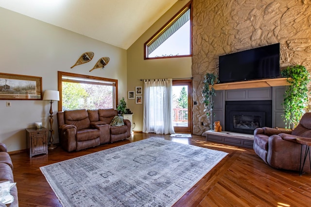 6385 13th Ave NW, Rochester, MN 55901 - living room with high vaulted ceiling, a large fireplace, and wood finished floors