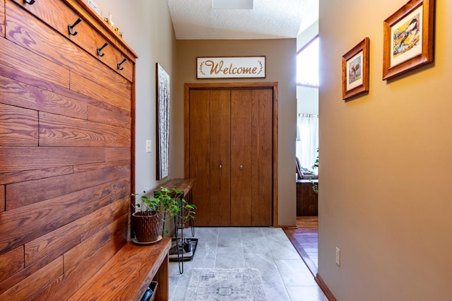 6385 13th Ave NW, Rochester, MN 55901 - entryway featuring healthy amount of natural light and a textured ceiling