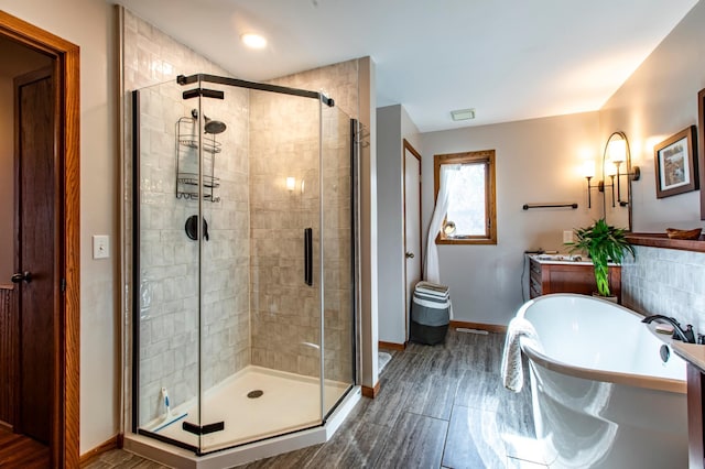 6385 13th Ave NW, Rochester, MN 55901 - full bath with a stall shower, baseboards, a freestanding bath, and vanity