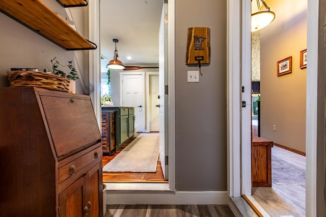 6385 13th Ave NW, Rochester, MN 55901 - corridor with baseboards and wood finished floors