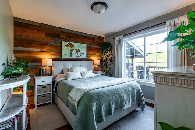 6385 13th Ave NW, Rochester, MN 55901 - bedroom featuring wood finished floors and wooden walls