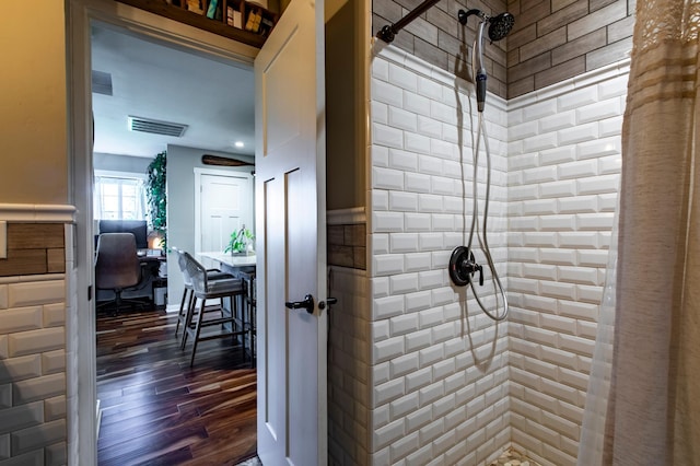 6385 13th Ave NW, Rochester, MN 55901 - full bathroom featuring tiled shower and wood finished floors