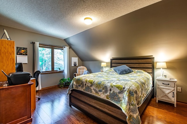 6385 13th Ave NW, Rochester, MN 55901 - bedroom with lofted ceiling, wood finished floors, baseboards, and a textured ceiling