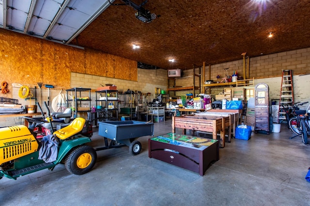 6385 13th Ave NW, Rochester, MN 55901 - garage featuring a workshop area