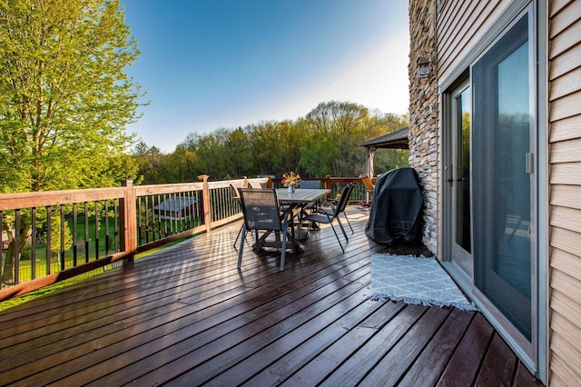 6385 13th Ave NW, Rochester, MN 55901 - wooden terrace featuring outdoor dining space