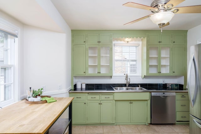 623 Fairview Ave S, Saint Paul, MN 55116 - kitchen featuring appliances with stainless steel finishes, green cabinetry, a ceiling fan, and glass insert cabinets
