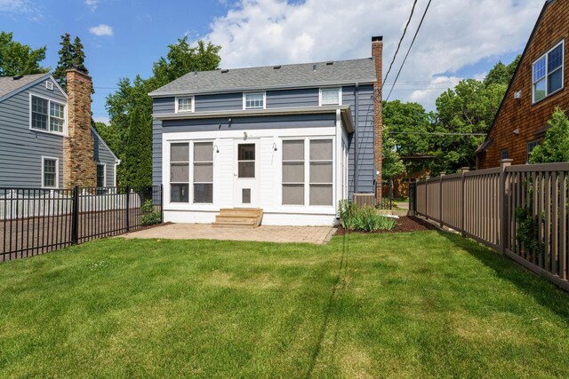 623 Fairview Ave S, Saint Paul, MN 55116 - back of property featuring a patio, a fenced backyard, a chimney, and entry steps