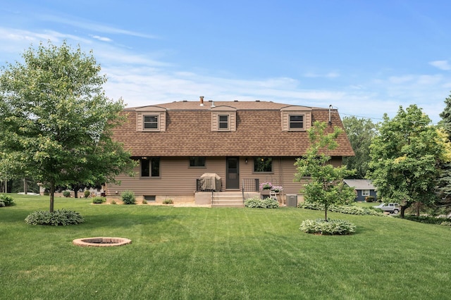 4824 Eriks Blvd, Eagan, MN 55122 - back of house with a shingled roof, a lawn, and mansard roof