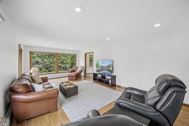 4824 Eriks Blvd, Eagan, MN 55122 - living room with a baseboard radiator, recessed lighting, and wood finished floors