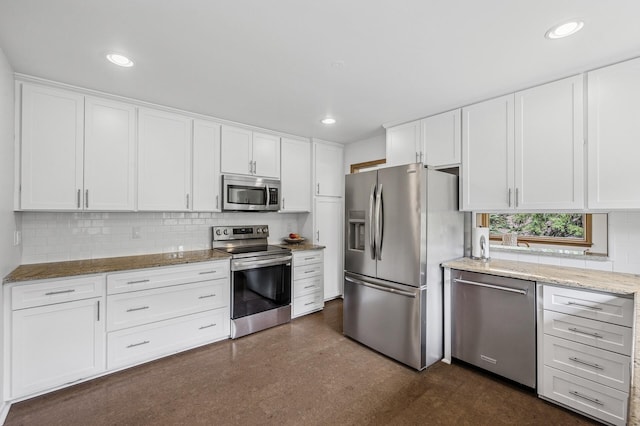 4824 Eriks Blvd, Eagan, MN 55122 - kitchen with appliances with stainless steel finishes, decorative backsplash, white cabinetry, light stone countertops, and recessed lighting