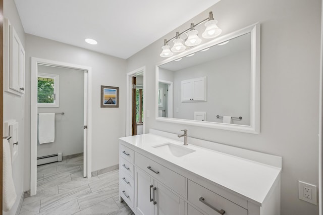 4824 Eriks Blvd, Eagan, MN 55122 - bathroom featuring a baseboard radiator, vanity, marble look tile flooring, and baseboards