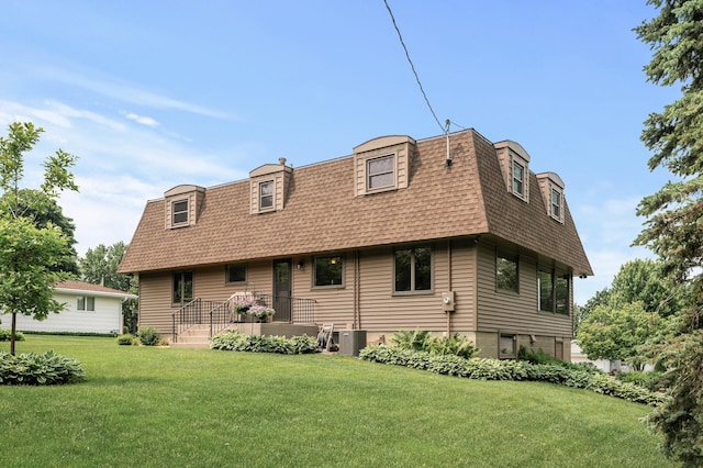 4824 Eriks Blvd, Eagan, MN 55122 - view of front of home with mansard roof, roof with shingles, a front yard, and central AC