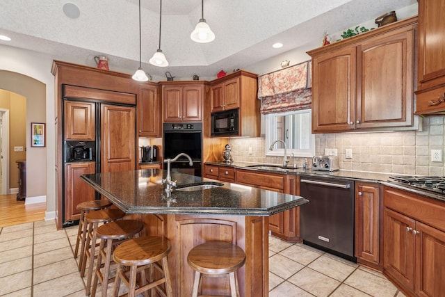 130 Stonebridge Rd, Lilydale, MN 55118 - kitchen with black appliances, a sink, light tile patterned floors, brown cabinets, and recessed lighting