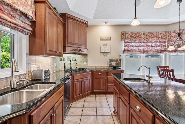130 Stonebridge Rd, Lilydale, MN 55118 - kitchen with a sink, brown cabinetry, hanging light fixtures, and a textured ceiling